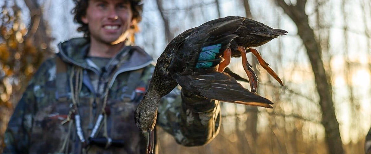 hunter holding duck