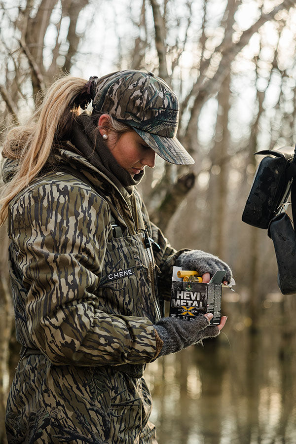 Maggie Williams holding box of HEVI-Metal Xtreme