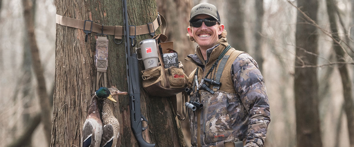 Seth Dortch standing by a tree