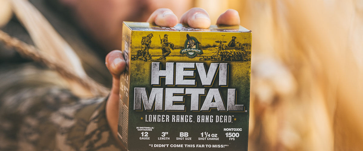 hunter holding up a HEVI-Metal box