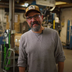 Manuel Standing inside the HEVI-Shot Factory